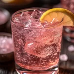 Pink salt detox drink with lemon and ice in a clear glass – pink salt recipe for weight loss