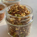 Healthy bariatric seed recipe in a glass jar with wooden spoon